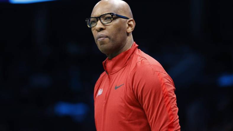 Mar 17, 2023; Charlotte, North Carolina, USA; Philadelphia 76ers assistant coach Sam Cassell looks on from the sideline during the first half against the Charlotte Hornets at Spectrum Center. Mandatory Credit: Brian Westerholt-USA TODAY Sports