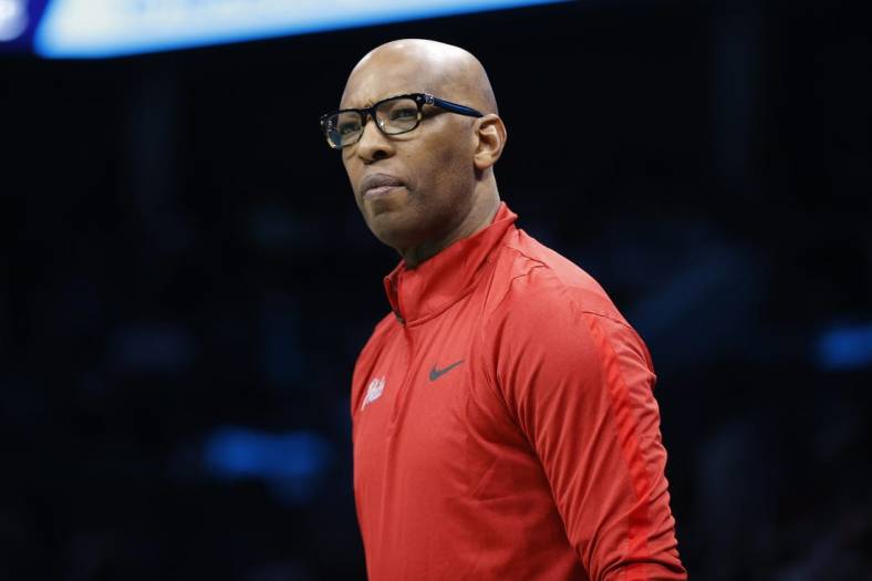 Mar 17, 2023; Charlotte, North Carolina, USA; Philadelphia 76ers assistant coach Sam Cassell looks on from the sideline during the first half against the Charlotte Hornets at Spectrum Center. Mandatory Credit: Brian Westerholt-USA TODAY Sports