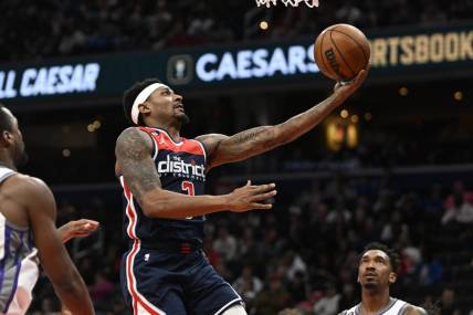 Mar 18, 2023; Washington, District of Columbia, USA; Washington Wizards guard Bradley Beal (3) scores against the Sacramento Kings during the second half at Capital One Arena. Mandatory Credit: Brad Mills-USA TODAY Sports