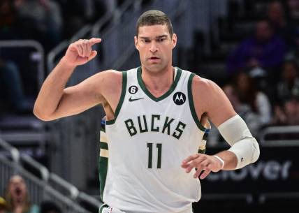 Mar 19, 2023; Milwaukee, Wisconsin, USA; Milwaukee Bucks center Brook Lopez (11) reacts after scoring a basket in the fourth quarter during game against the Toronto Raptors at Fiserv Forum. Mandatory Credit: Benny Sieu-USA TODAY Sports