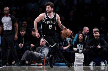 Mar 21, 2023; Brooklyn, New York, USA; Brooklyn Nets forward Joe Harris (12) dribbles during the first half against the Cleveland Cavaliers at Barclays Center. Mandatory Credit: Vincent Carchietta-USA TODAY Sports