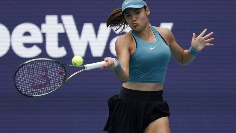 Mar 22, 2023; Miami, Florida, US; Emma Raducanu (GBR) hits a forehand against Bianca Andreescu (CAN) (not pictured) on day three of the Miami Open at Hard Rock Stadium. Mandatory Credit: Geoff Burke-USA TODAY Sports