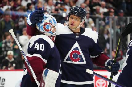 Mar 24, 2023; Denver, Colorado, USA; Colorado Avalanche goaltender Alexandar Georgiev (40) and defenseman Erik Johnson (6) celebrate defeating the Arizona Coyotes at Ball Arena. Mandatory Credit: Ron Chenoy-USA TODAY Sports