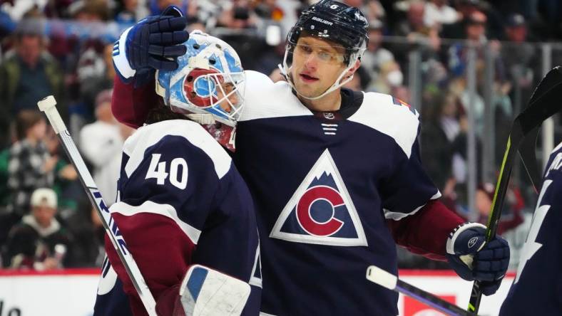 Mar 24, 2023; Denver, Colorado, USA; Colorado Avalanche goaltender Alexandar Georgiev (40) and defenseman Erik Johnson (6) celebrate defeating the Arizona Coyotes at Ball Arena. Mandatory Credit: Ron Chenoy-USA TODAY Sports