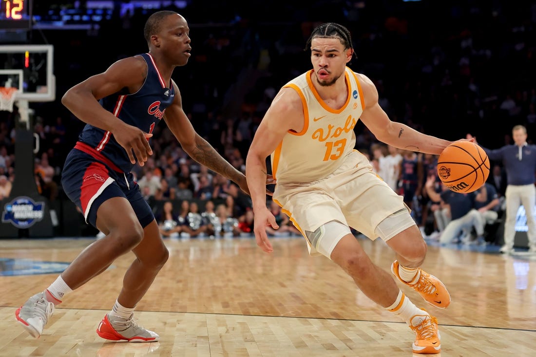 Mar 23, 2023; New York, NY, USA; Tennessee Volunteers forward Olivier Nkamhoua (13) drives to the basket against Florida Atlantic Owls guard Johnell Davis (1) during the second half at Madison Square Garden. Mandatory Credit: Brad Penner-USA TODAY Sports