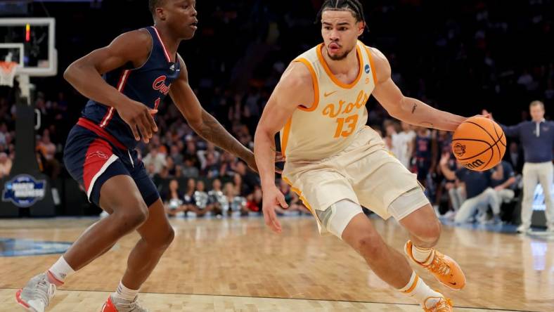 Mar 23, 2023; New York, NY, USA; Tennessee Volunteers forward Olivier Nkamhoua (13) drives to the basket against Florida Atlantic Owls guard Johnell Davis (1) during the second half at Madison Square Garden. Mandatory Credit: Brad Penner-USA TODAY Sports