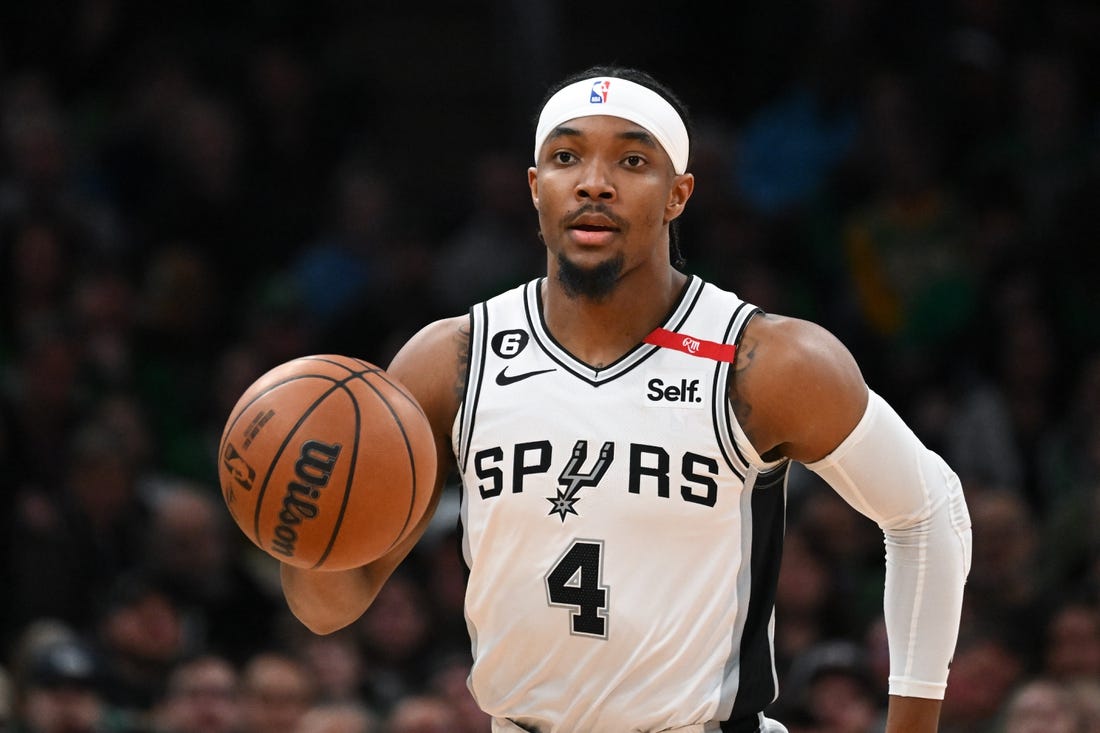 Mar 26, 2023; Boston, Massachusetts, USA; San Antonio Spurs guard Devonte' Graham (4) dribbles the ball against the Boston Celtics during the first quarter at the TD Garden. Mandatory Credit: Brian Fluharty-USA TODAY Sports