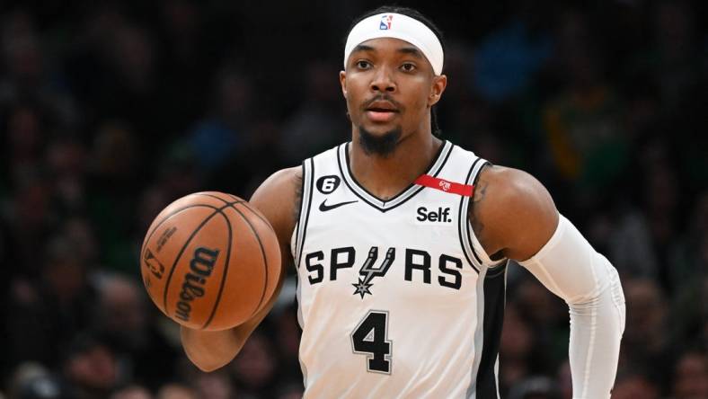 Mar 26, 2023; Boston, Massachusetts, USA; San Antonio Spurs guard Devonte' Graham (4) dribbles the ball against the Boston Celtics during the first quarter at the TD Garden. Mandatory Credit: Brian Fluharty-USA TODAY Sports