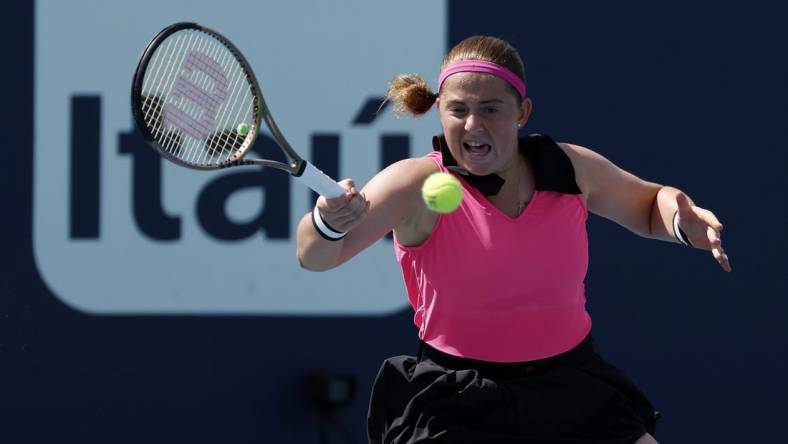 Mar 27, 2023; Miami, Florida, US; Jelena Ostapenko (LAT) hits a forehand against Martina Trevisan (ITA) (not pictured) on day eight of the Miami Open at Hard Rock Stadium. Mandatory Credit: Geoff Burke-USA TODAY Sports