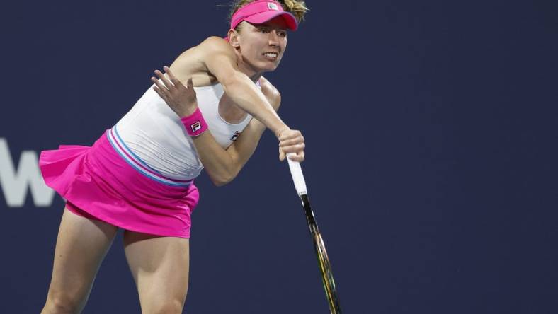 Mar 27, 2023; Miami, Florida, US; Ekaterina Alexandrova serves against Bianca Andreescu (CAN) (not pictured) on day eight of the Miami Open at Hard Rock Stadium. Mandatory Credit: Geoff Burke-USA TODAY Sports