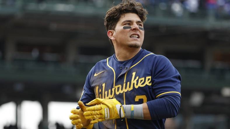 Mar 30, 2023; Chicago, Illinois, USA;  Milwaukee Brewers third baseman Luis Urias (2) reacts after being tagged out at first base during the ninth inning at Wrigley Field. Mandatory Credit: Kamil Krzaczynski-USA TODAY Sports