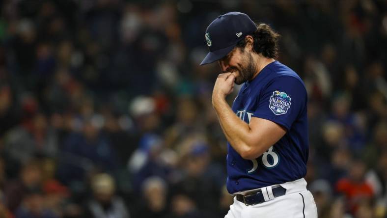 Mar 31, 2023; Seattle, Washington, USA; Seattle Mariners starting pitcher Robbie Ray (38) walks to the dugout during a fourth inning pitching change against the Cleveland Guardians at T-Mobile Park. Mandatory Credit: Joe Nicholson-USA TODAY Sports