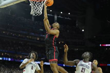 Apr 3, 2023; Houston, TX, USA; San Diego State Aztecs guard Lamont Butler (5) shoots the ball against the Connecticut Huskies during the second half in the national championship game of the 2023 NCAA Tournament at NRG Stadium. Mandatory Credit: Bob Donnan-USA TODAY Sports