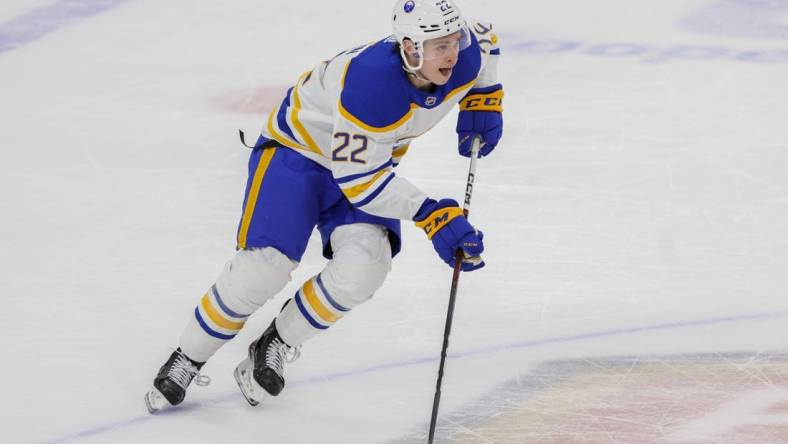 Apr 4, 2023; Sunrise, Florida, USA; Buffalo Sabres right wing Jack Quinn (22) moves the puck during the third period against the Florida Panthers at FLA Live Arena. Mandatory Credit: Sam Navarro-USA TODAY Sports