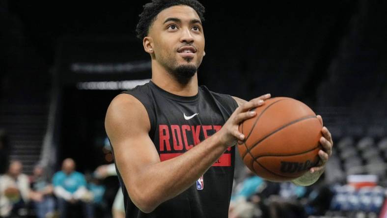 Apr 7, 2023; Charlotte, North Carolina, USA; Houston Rockets forward Kenyon Martin Jr. (6) shoots during pregame warm ups against the Charlotte Hornets at the Spectrum Center. Mandatory Credit: Jim Dedmon-USA TODAY Sports