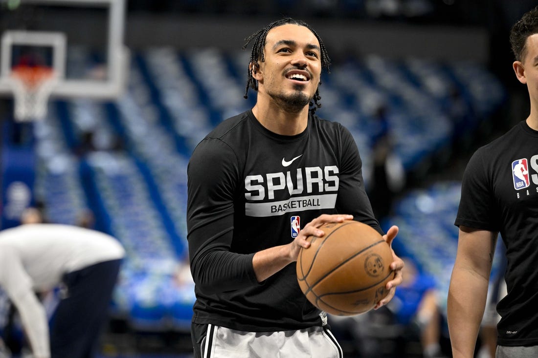 Apr 9, 2023; Dallas, Texas, USA; San Antonio Spurs guard Tre Jones (33) warms up before the game between the Dallas Mavericks and the San Antonio Spurs at the American Airlines Center. Mandatory Credit: Jerome Miron-USA TODAY Sports