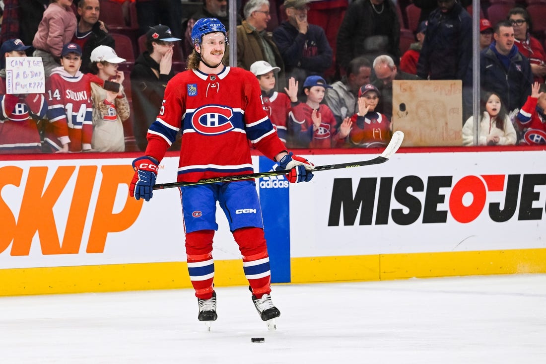 Apr 4, 2023; Montreal, Quebec, CAN; Montreal Canadiens left wing Michael Pezzetta (55) stands smiling while watching his teammates during warm-up before the game against the Detroit Red Wings at Bell Centre. Mandatory Credit: David Kirouac-USA TODAY Sports