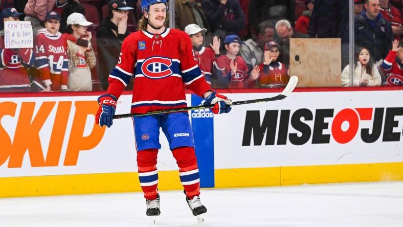 Apr 4, 2023; Montreal, Quebec, CAN; Montreal Canadiens left wing Michael Pezzetta (55) stands smiling while watching his teammates during warm-up before the game against the Detroit Red Wings at Bell Centre. Mandatory Credit: David Kirouac-USA TODAY Sports