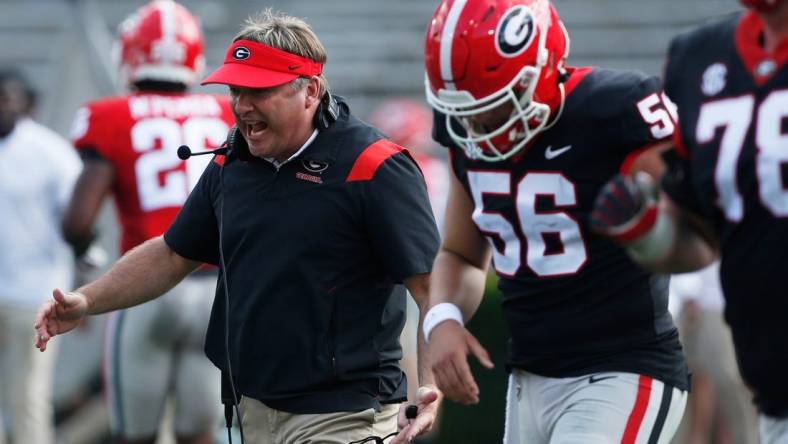 Georgia head coach Kirby Smart speaks with the black team during the UGA G-Day spring football game at Sanford Stadium in Athens on Saturday.

News Joshua L Jones