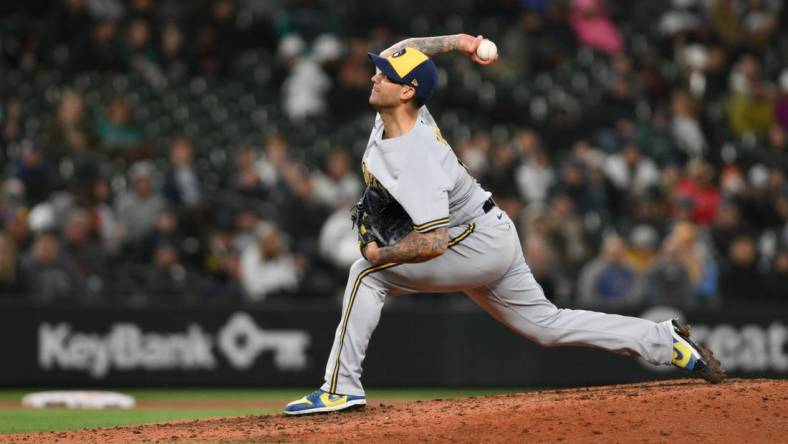 Apr 18, 2023; Seattle, Washington, USA; Milwaukee Brewers relief pitcher Matt Bush (21) pitches to the Seattle Mariners during the eighth inning at T-Mobile Park. Mandatory Credit: Steven Bisig-USA TODAY Sports