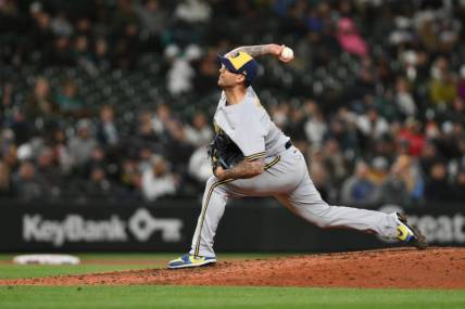 Apr 18, 2023; Seattle, Washington, USA; Milwaukee Brewers relief pitcher Matt Bush (21) pitches to the Seattle Mariners during the eighth inning at T-Mobile Park. Mandatory Credit: Steven Bisig-USA TODAY Sports