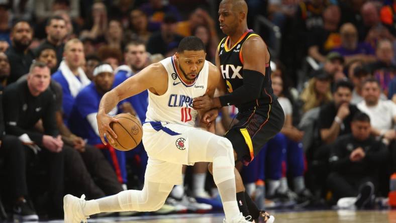 Apr 18, 2023; Phoenix, Arizona, USA; Los Angeles Clippers guard Eric Gordon (10) moves the ball against Phoenix Suns guard Chris Paul (3) in the second half during game two of the 2023 NBA playoffs at Footprint Center. Mandatory Credit: Mark J. Rebilas-USA TODAY Sports