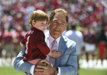 Apr 22, 2023; Tuscaloosa, AL, USA; Alabama head coach Nick Saban holds his grandson before the A-Day game at Bryant-Denny Stadium. Mandatory Credit: Gary Cosby-USA TODAY Sports