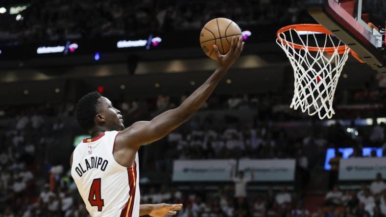 Apr 22, 2023; Miami, Florida, USA; Miami Heat guard Victor Oladipo (4) drives to the basket in the fourth quarter against the Milwaukee Bucks during game three of the 2023 NBA Playoffs at Kaseya Center. Mandatory Credit: Sam Navarro-USA TODAY Sports