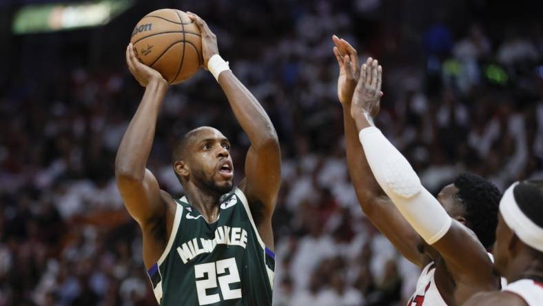 Apr 22, 2023; Miami, Florida, USA; Milwaukee Bucks forward Khris Middleton (22) shoots the basketball in the second quarter against the Miami Heat during game three of the 2023 NBA Playoffs at Kaseya Center. Mandatory Credit: Sam Navarro-USA TODAY Sports