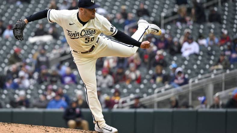 Apr 23, 2023; Minneapolis, Minnesota, USA;  Minnesota Twins pitcher Caleb Thielbar (56) delivers against the Minnesota Twins at Target Field. Mandatory Credit: Nick Wosika-USA TODAY Sports