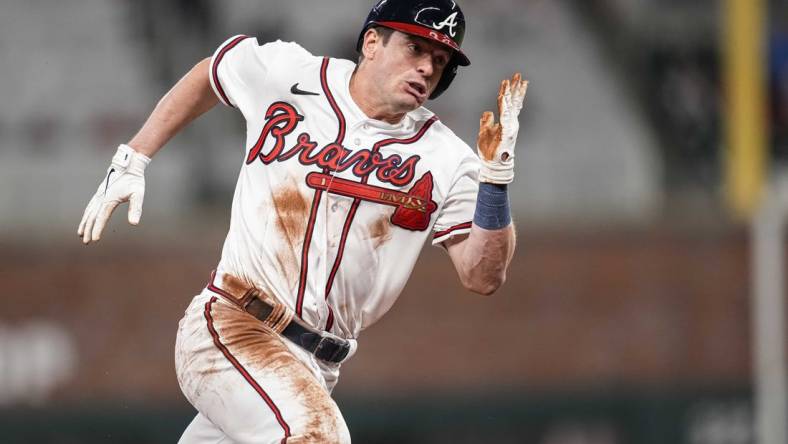 Apr 26, 2023; Cumberland, Georgia, USA;  Atlanta Braves pinch runner Nick Solak (15) scores a run against the Miami Marlins during the eighth inning at Truist Park. Mandatory Credit: Dale Zanine-USA TODAY Sports