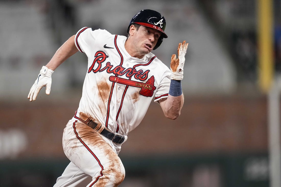 Apr 26, 2023; Cumberland, Georgia, USA;  Atlanta Braves pinch runner Nick Solak (15) scores a run against the Miami Marlins during the eighth inning at Truist Park. Mandatory Credit: Dale Zanine-USA TODAY Sports