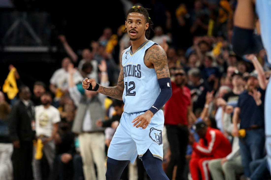 Apr 26, 2023; Memphis, Tennessee, USA; Memphis Grizzlies guard Ja Morant (12) reacts during the second half against the Los Angeles Lakers during game five of the 2023 NBA playoffs at FedExForum. Mandatory Credit: Petre Thomas-USA TODAY Sports