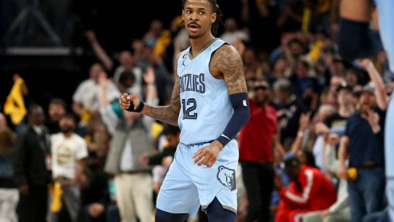 Apr 26, 2023; Memphis, Tennessee, USA; Memphis Grizzlies guard Ja Morant (12) reacts during the second half against the Los Angeles Lakers during game five of the 2023 NBA playoffs at FedExForum. Mandatory Credit: Petre Thomas-USA TODAY Sports