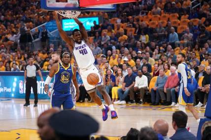 Apr 28, 2023; San Francisco, California, USA; Sacramento Kings forward Harrison Barnes (40) dunks the ball in front of Golden State Warriors forward Kevon Looney (5) in the first quarter during game six of the 2023 NBA playoffs at the Chase Center. Mandatory Credit: Cary Edmondson-USA TODAY Sports