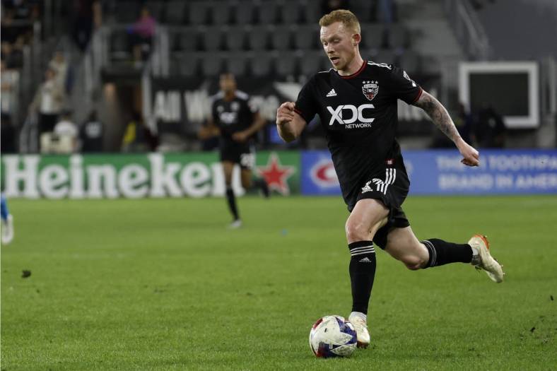 Apr 29, 2023; Washington, District of Columbia, USA; D.C. United midfielder Lewis O'Brien (17) dribbles the ball against Charlotte FC at Audi Field. Mandatory Credit: Geoff Burke-USA TODAY Sports