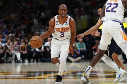 May 1, 2023; Denver, Colorado, USA; Phoenix Suns guard Chris Paul (3) controls the ball in the first quarter against the Denver Nuggets during game two of the 2023 NBA playoffs at Ball Arena. Mandatory Credit: Ron Chenoy-USA TODAY Sports