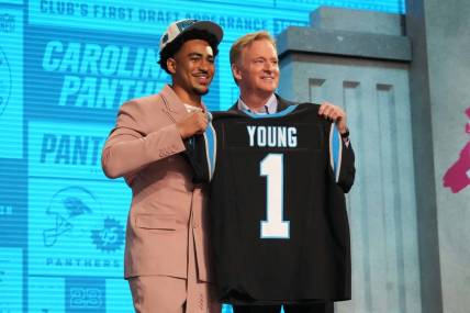 Apr 27, 2023; Kansas City, MO, USA; Alabama Crimson Tide quarterback Bryce Young (left) poses with NFL commissioner Roger Goodell after being selected by the Carolina Panthers as the No. 1 pick in the first round of the 2023 NFL Draft at Union Station. Mandatory Credit: Kirby Lee-USA TODAY Sports