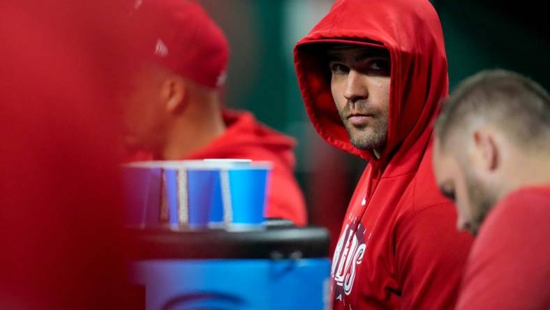 Injured Cincinnati Reds first baseman Joey Votto (19) walks discreetly though the dugout in the eighth inning of the MLB Interleague game between the Cincinnati Reds and the Chicago White Sox at Great American Ball Park in downtown Cincinnati on Friday, May 5, 2023. The Reds lost the opening game of the series, 5-4.