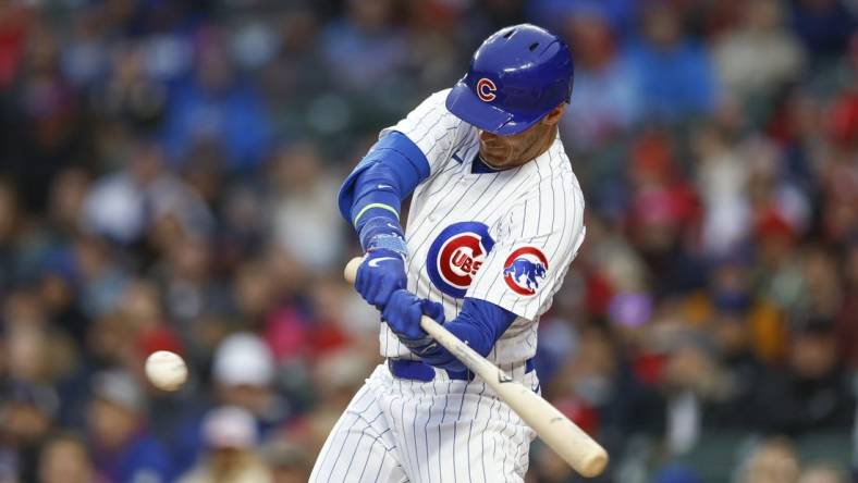 May 8, 2023; Chicago, Illinois, USA; Chicago Cubs center fielder Cody Bellinger (24) singles against the St. Louis Cardinals during the first inning at Wrigley Field. Mandatory Credit: Kamil Krzaczynski-USA TODAY Sports