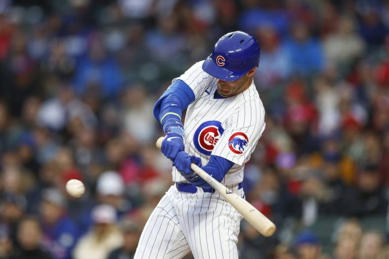 May 8, 2023; Chicago, Illinois, USA; Chicago Cubs center fielder Cody Bellinger (24) singles against the St. Louis Cardinals during the first inning at Wrigley Field. Mandatory Credit: Kamil Krzaczynski-USA TODAY Sports