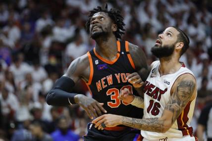May 8, 2023; Miami, Florida, USA; New York Knicks forward Julius Randle (30) and Miami Heat forward Caleb Martin (16) look on during a free-throw attempt in the fourth quarter during game four of the 2023 NBA playoffs at Kaseya Center. Mandatory Credit: Sam Navarro-USA TODAY Sports