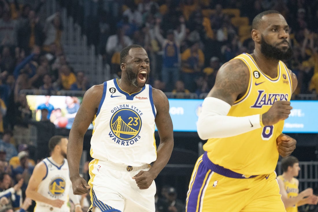 May 10, 2023; San Francisco, California, USA; Golden State Warriors forward Draymond Green (23) celebrates against Los Angeles Lakers forward LeBron James (6) during the first quarter in game five of the 2023 NBA playoffs conference semifinals round at Chase Center. Mandatory Credit: Kyle Terada-USA TODAY Sports