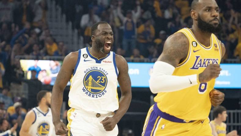 May 10, 2023; San Francisco, California, USA; Golden State Warriors forward Draymond Green (23) celebrates against Los Angeles Lakers forward LeBron James (6) during the first quarter in game five of the 2023 NBA playoffs conference semifinals round at Chase Center. Mandatory Credit: Kyle Terada-USA TODAY Sports