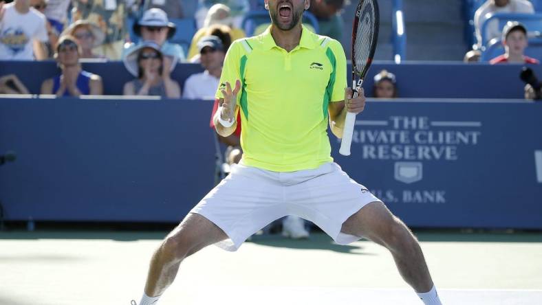 Marin Cilic celebrates after beating Andy Murray, 6-4, 7-5, to win the Western and Southern Open at The Lindner Family Tennis Center in Mason Sunday August 21, 2016.