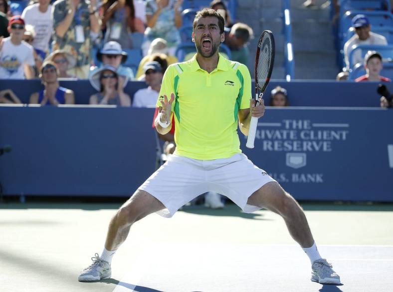Marin Cilic celebrates after beating Andy Murray, 6-4, 7-5, to win the Western and Southern Open at The Lindner Family Tennis Center in Mason Sunday August 21, 2016.
