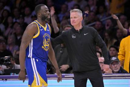 May 12, 2023; Los Angeles, California, USA; Golden State Warriors forward Draymond Green (23) walks past head coach Steve Kerr after fouling out in the second half of game six of the 2023 NBA playoffs at Crypto.com Arena. Mandatory Credit: Jayne Kamin-Oncea-USA TODAY Sports