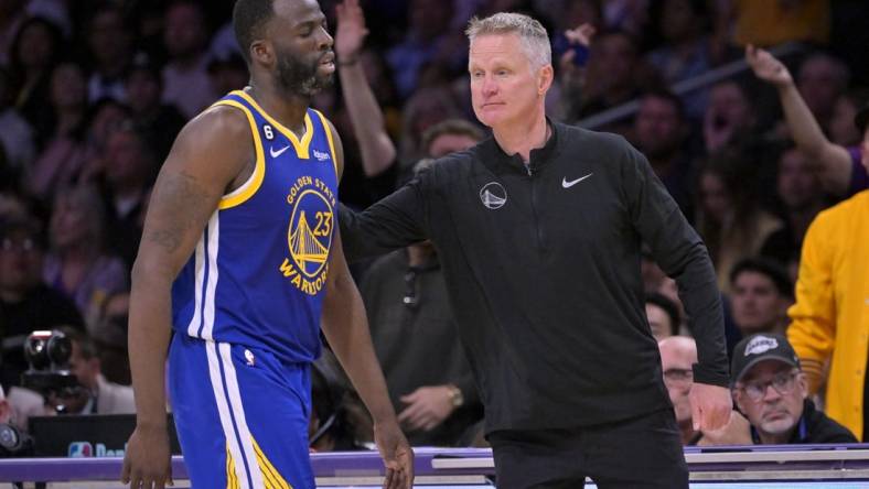 May 12, 2023; Los Angeles, California, USA; Golden State Warriors forward Draymond Green (23) walks past head coach Steve Kerr after fouling out in the second half of game six of the 2023 NBA playoffs at Crypto.com Arena. Mandatory Credit: Jayne Kamin-Oncea-USA TODAY Sports