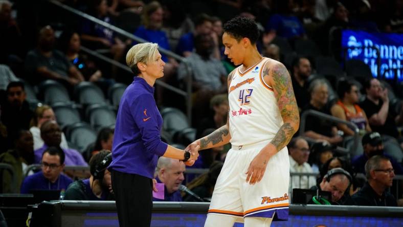 May 12, 2023; Phoenix, Ariz.; USA; Mercury center Brittney Griner (42) high-fives head coach Vanessa Nygaard during a game at the Footprint Center. Mandatory Credit: Patrick Breen-USA TODAY NETWORK