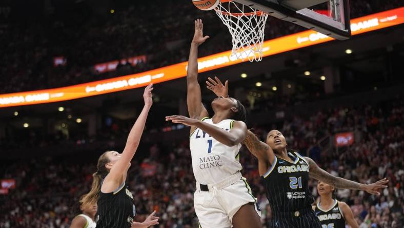 May 13, 2023; Toronto, Ontario, Canada; Minnesota Lynx forward Diamond Miller (1) goes to make a basket against Chicago Sky forward Robyn Parks (21) and forward Alanna Smith (8) during the second half at Scotiabank Arena. Mandatory Credit: John E. Sokolowski-USA TODAY Sports